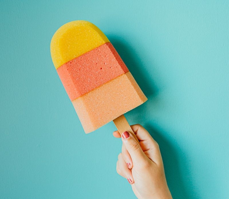 Colorful ice cream on blue background